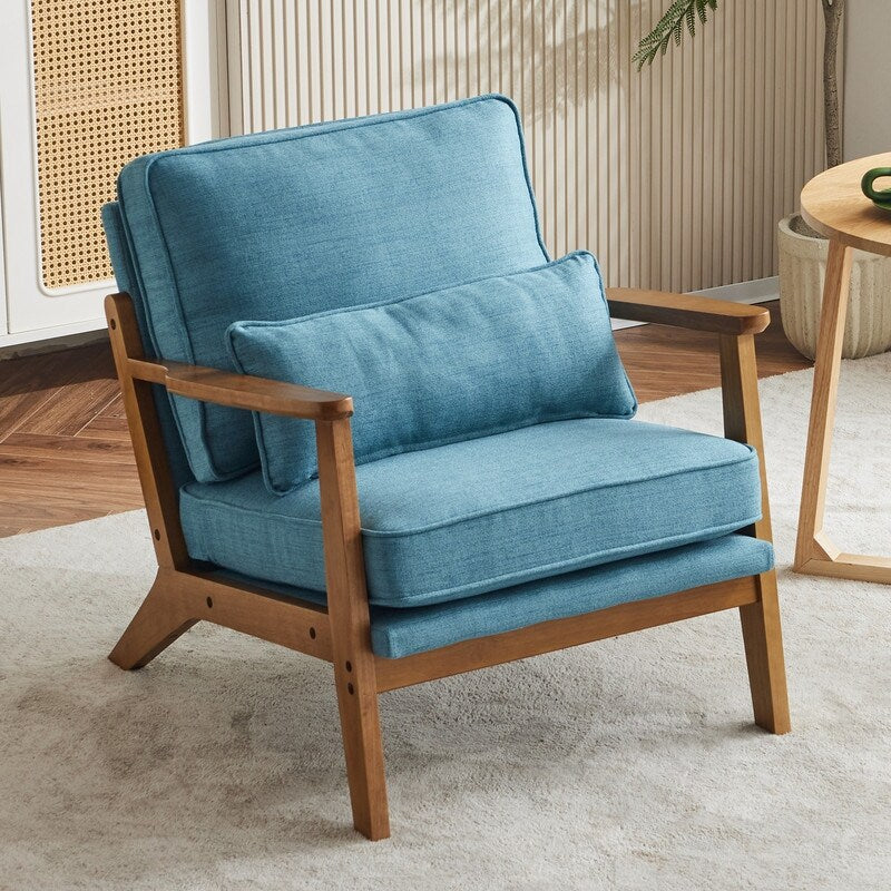 Poltrona d'accento rivestita in misto lino con gambe in legno e un cuscino, beige